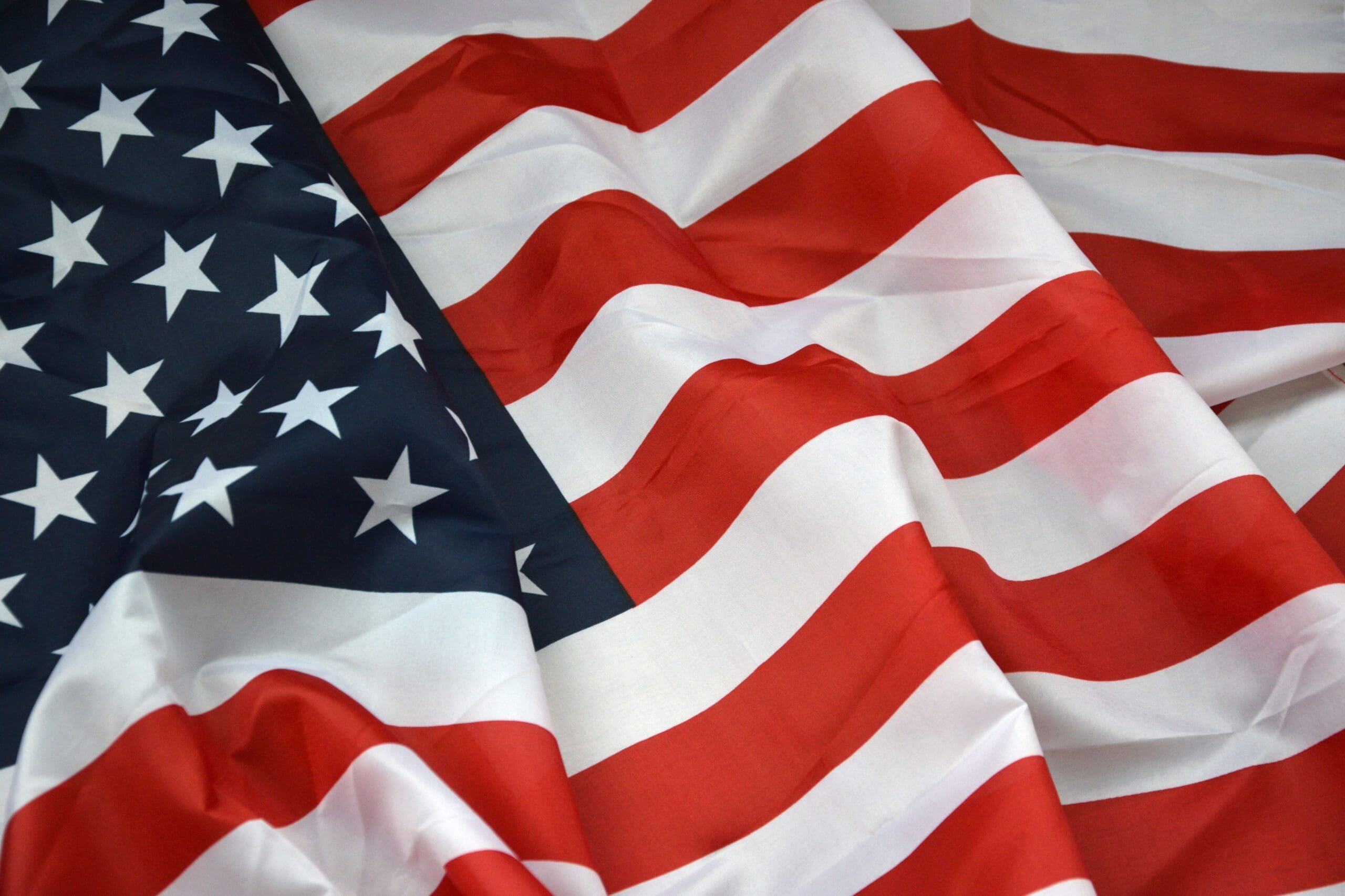 Closeup of American flag on plain background